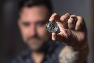 Man holding bitcoin crypto currency